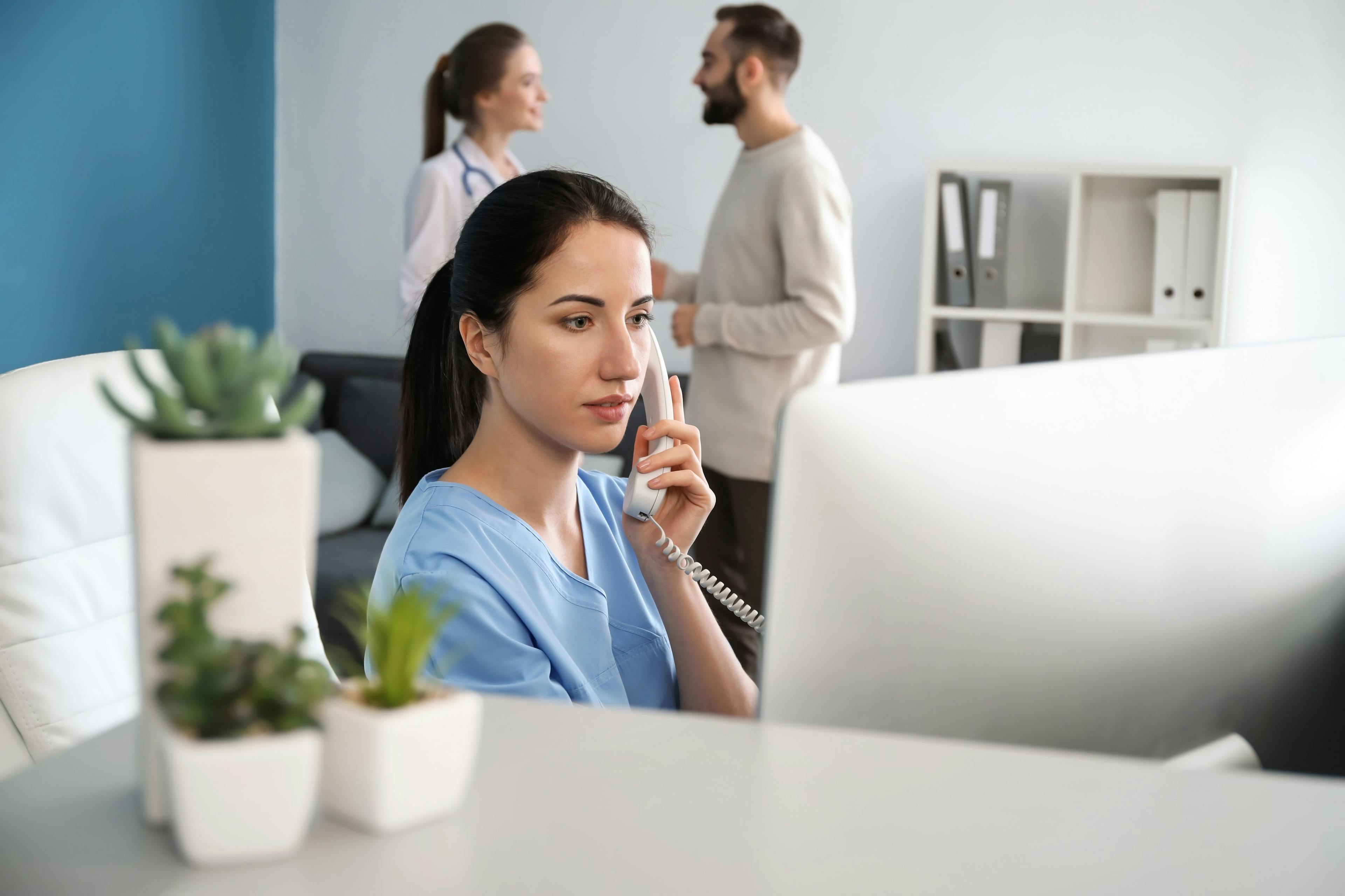 medical staffer on phone in medical office